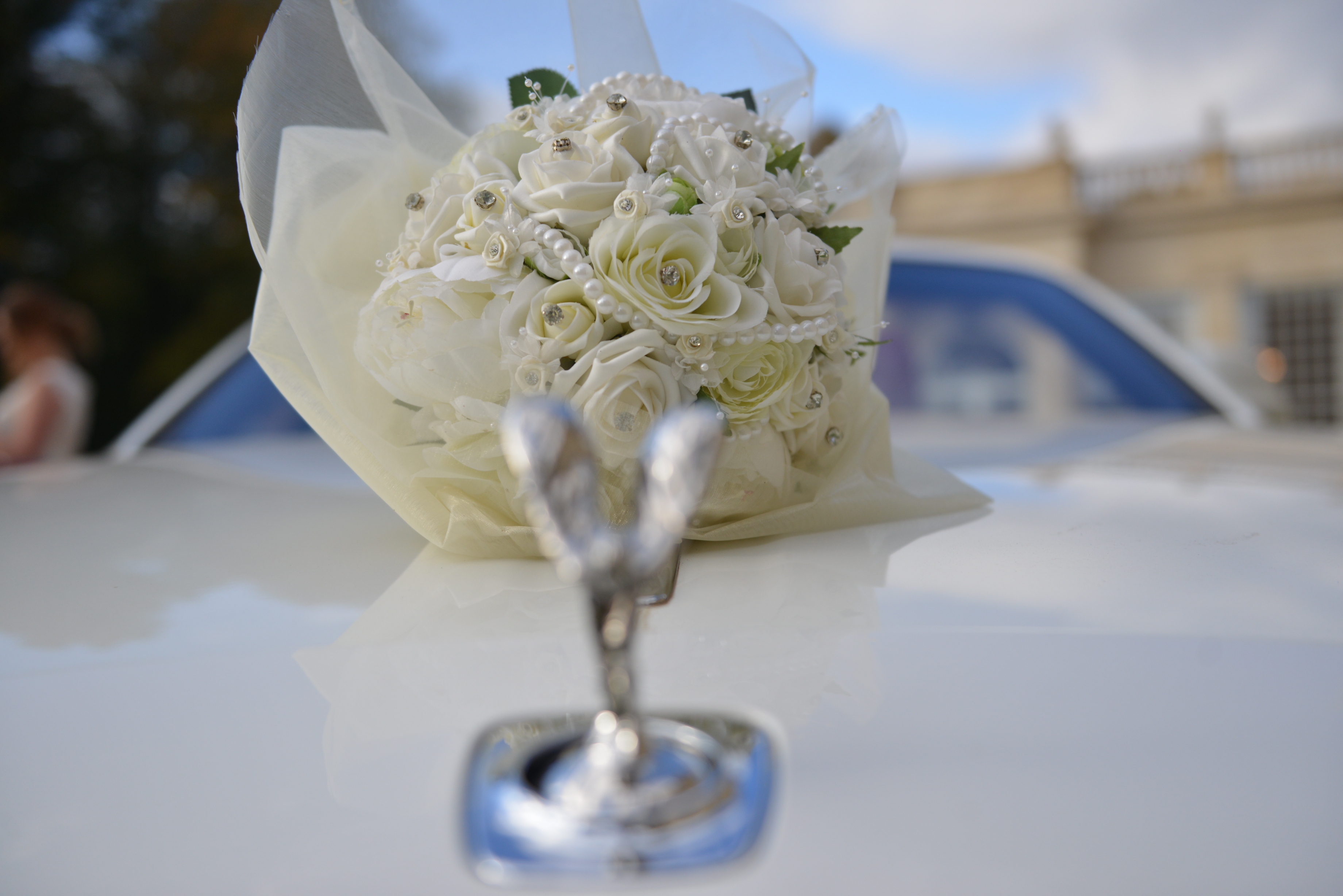 wedding car and floral bouquet