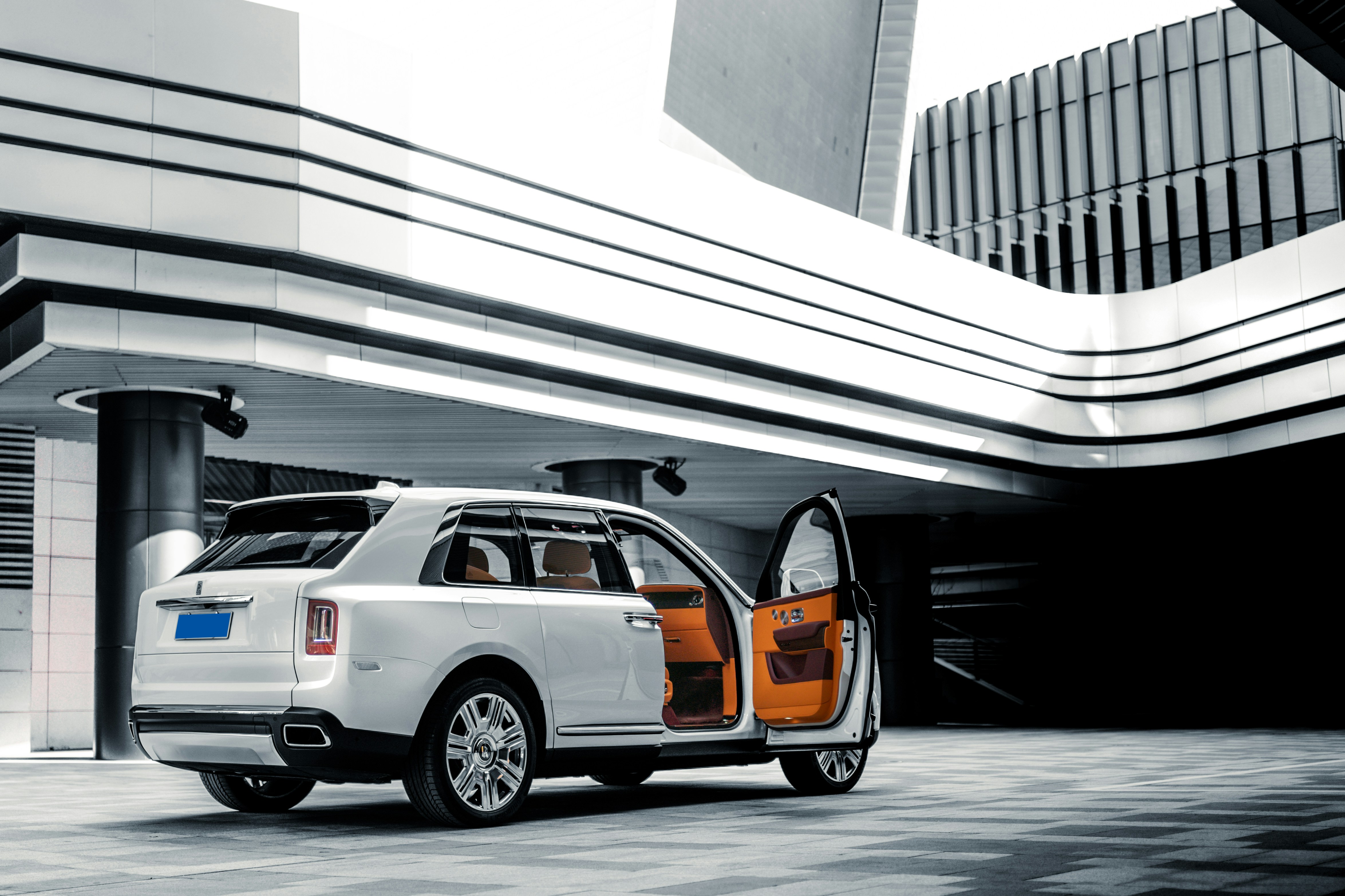 White Cullinan wedding car in modern city