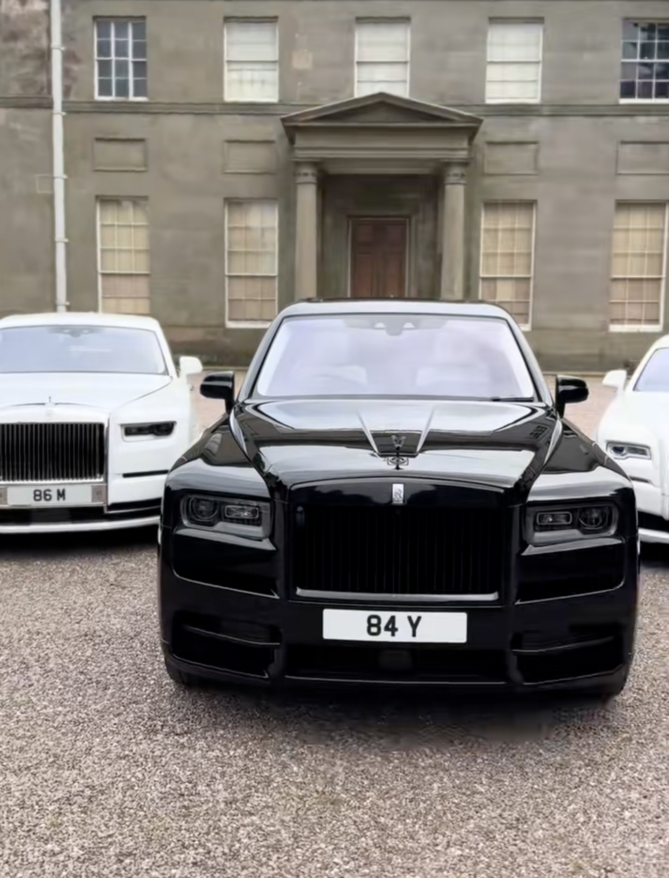 Black Cullinan with White Rolls-Royce fleet