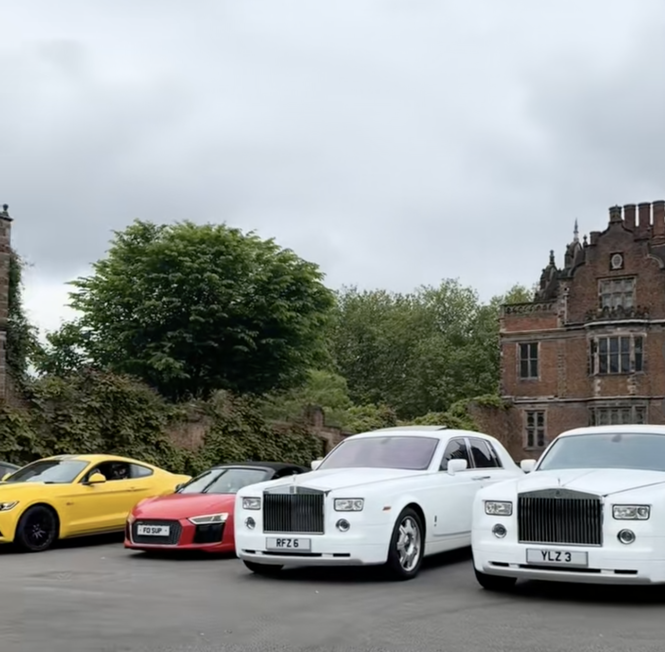 Rolls-Royce and supercar fleet outside Aston Hall wedding