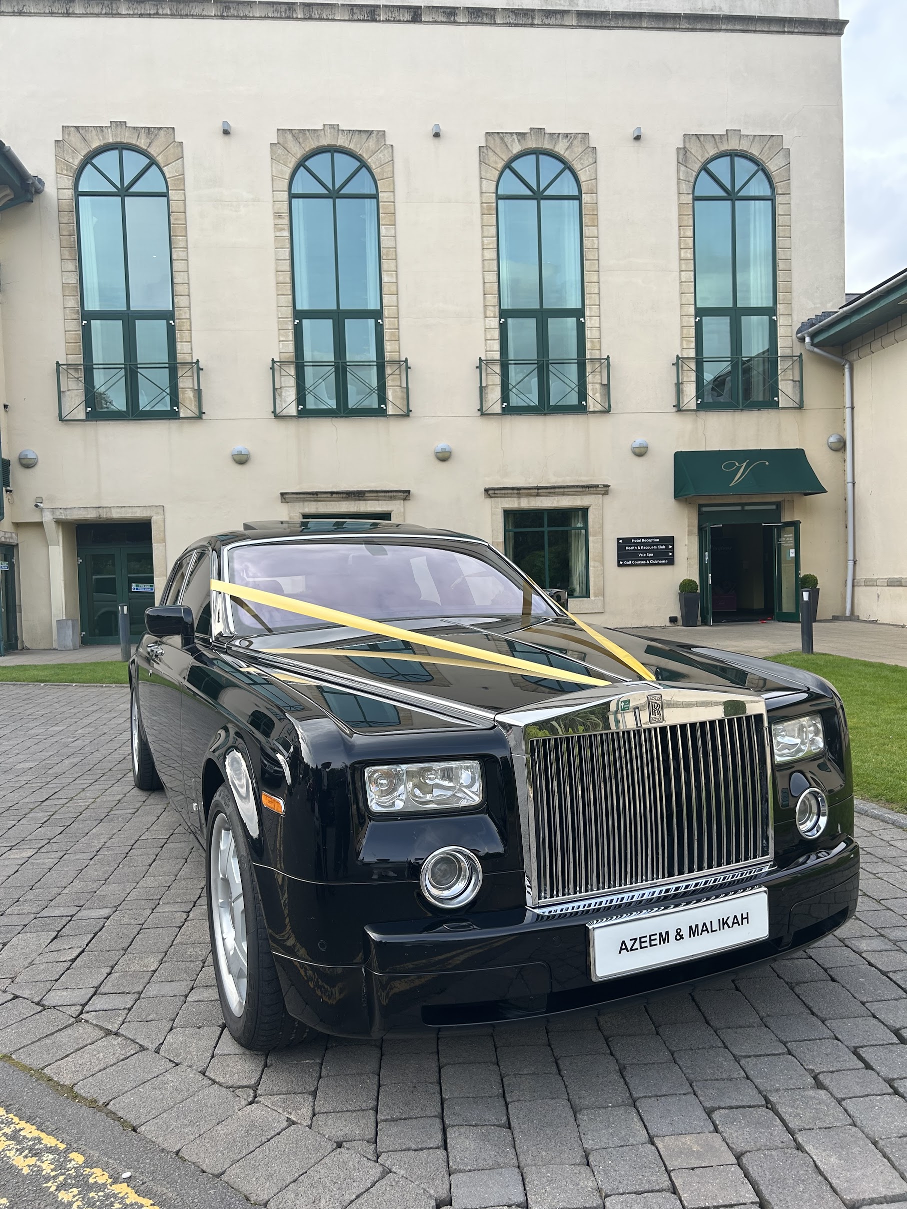 Black ROlls-Royce Phantom outside wedding venue
