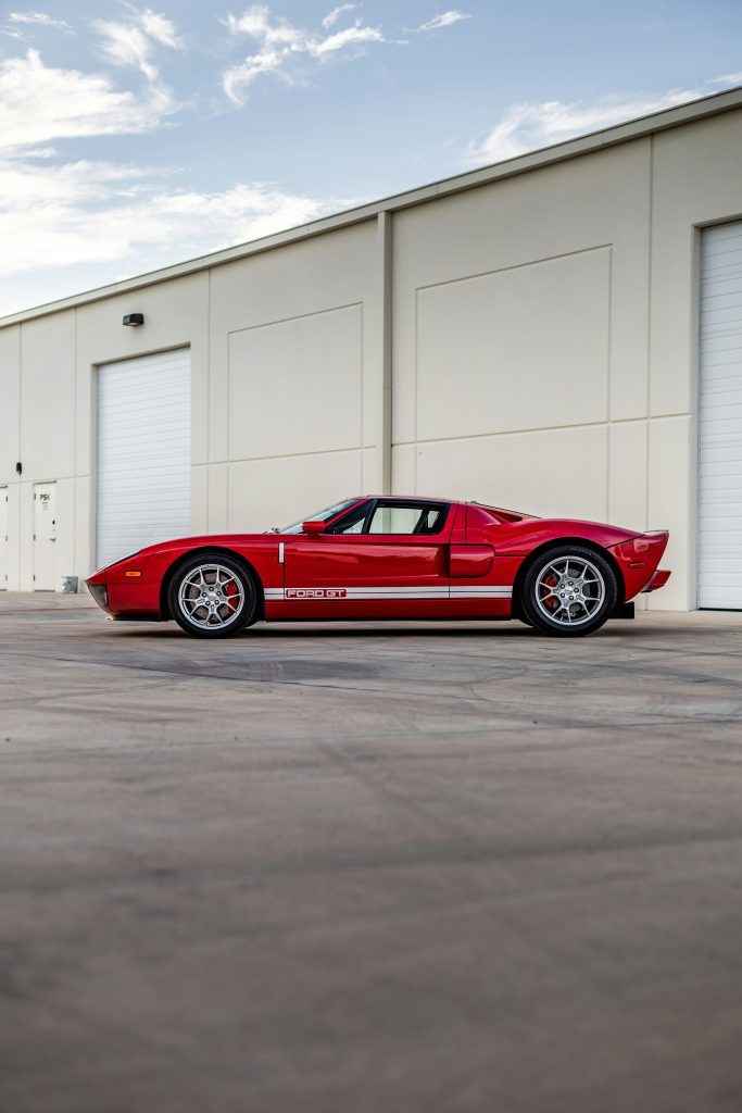 red Ford GT parked outside warehouse